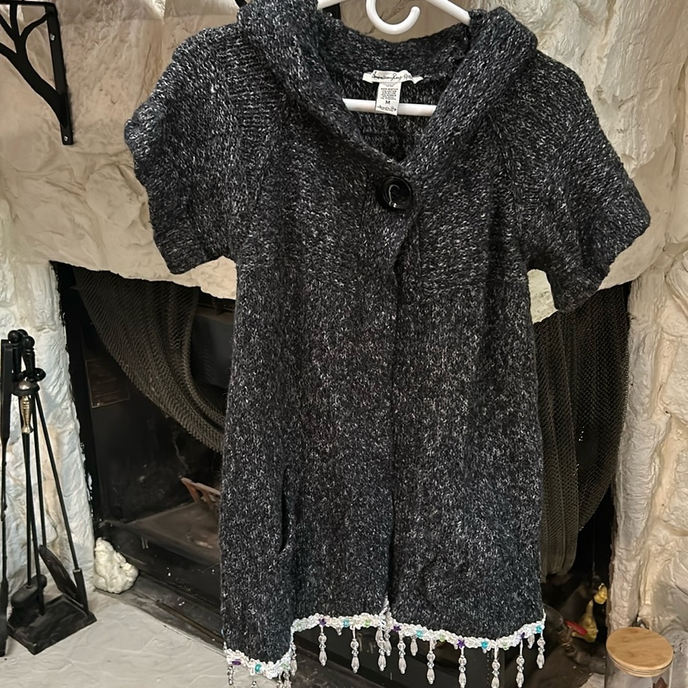 Medium Dark grey sweater with hanging beading on hem and crystal skull on back